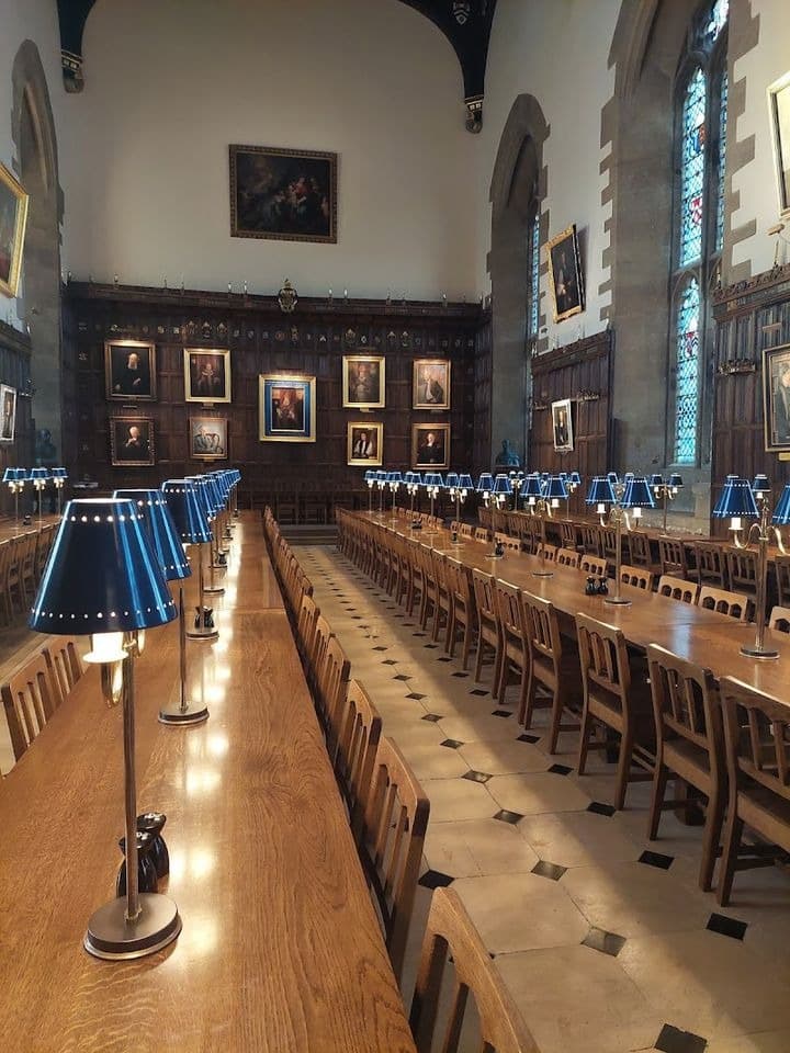 Long candlelit dining hall at an Oxford college
